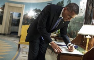 044857436-president-barack-obama-signs-a